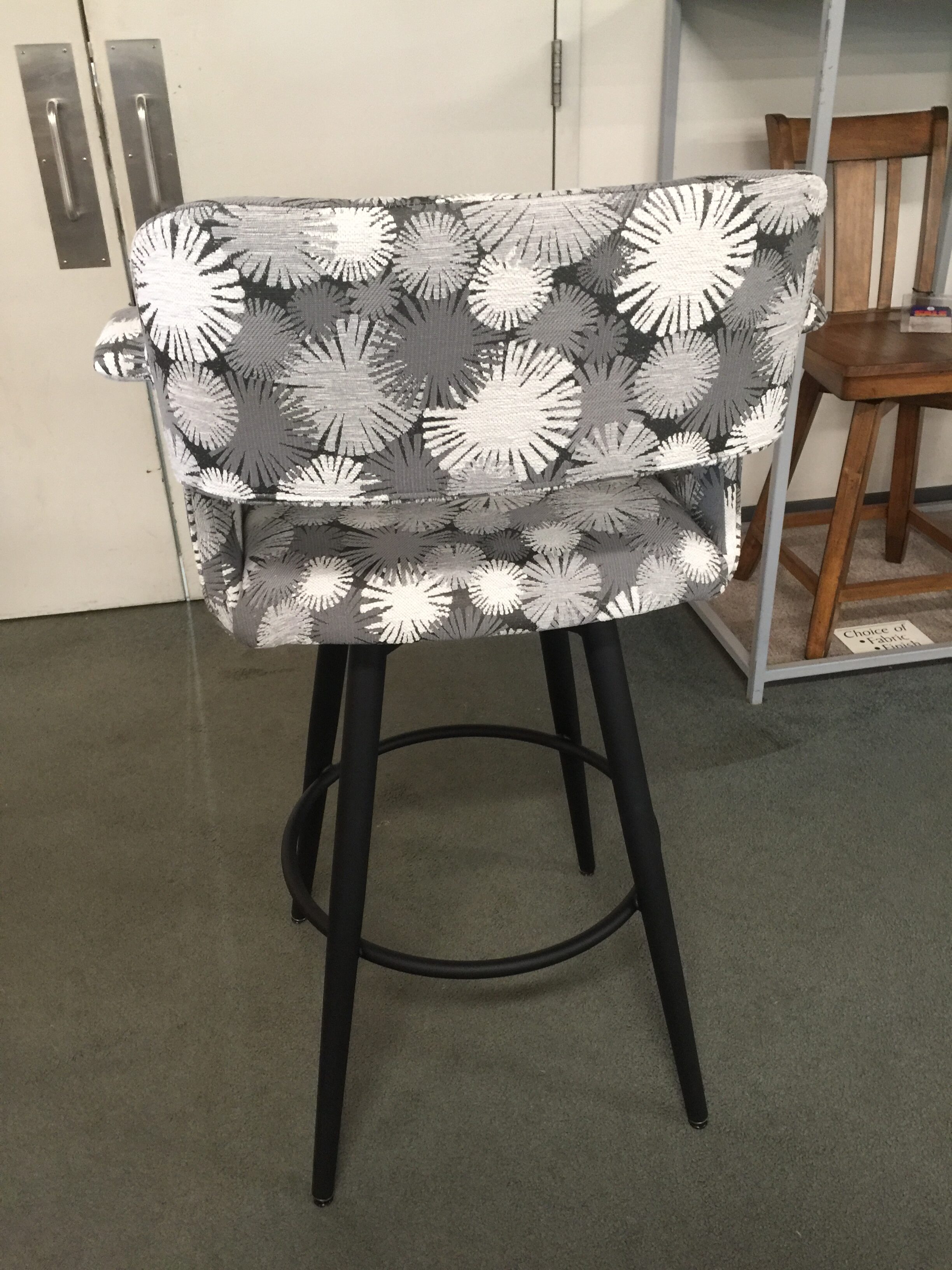 sorrento stool with custom fabric upholstering the arms, the back and swivel seat